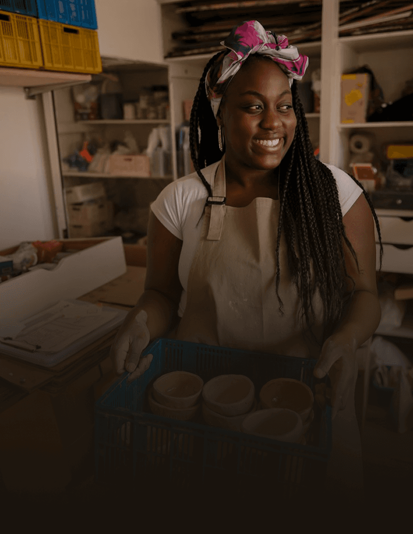 Local business owner managing artisan craft studio