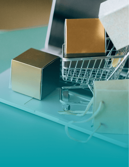 Online sellers e-commerce packages and shopping cart on laptop